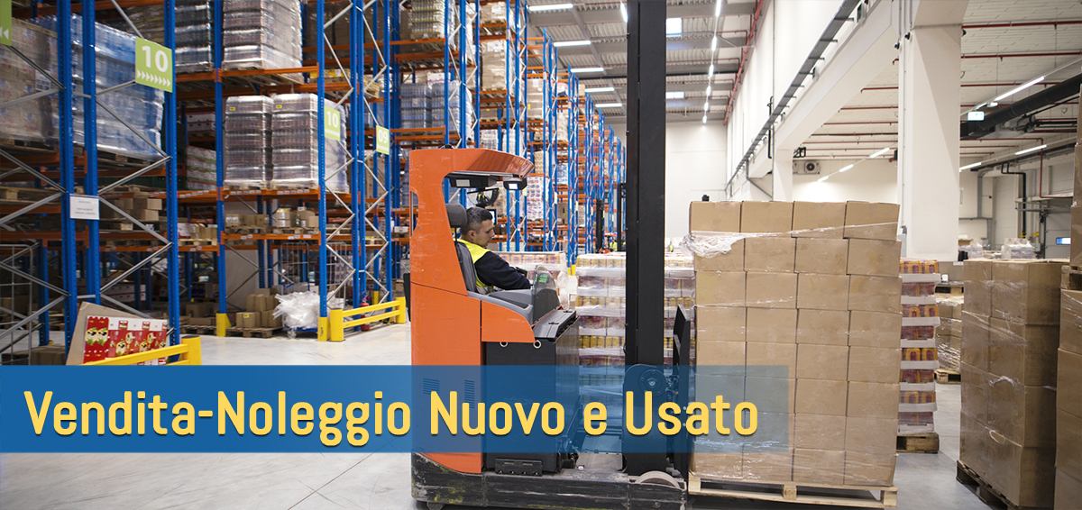 Two unrecognizable workers in reflective suit walking through warehouse and holding blue protective hardhats.